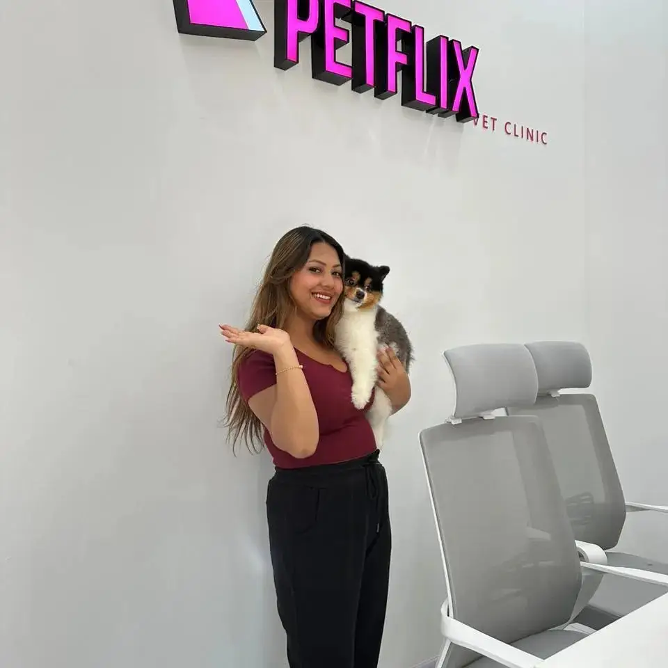 Front desk staff with a patient at reception
